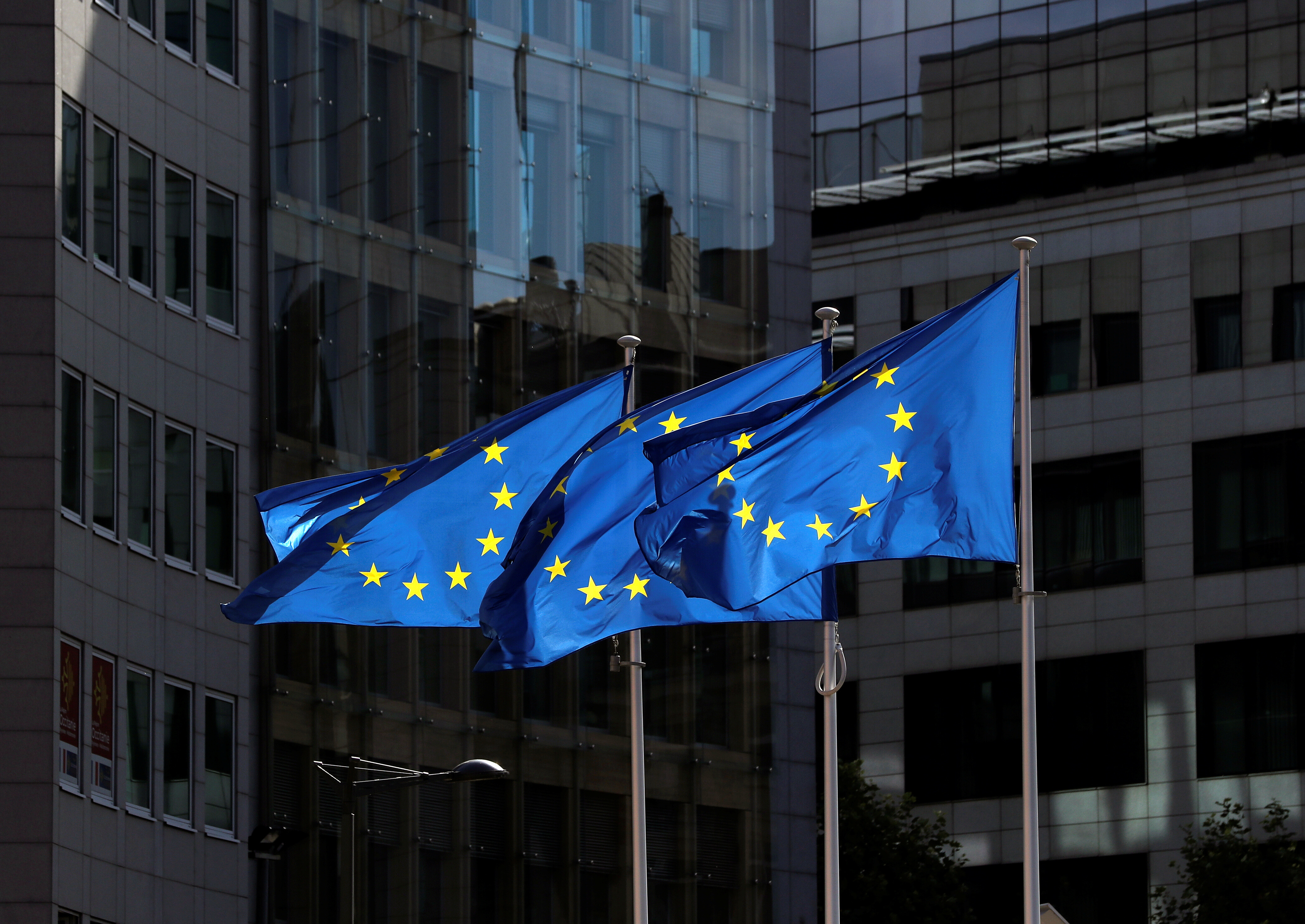 European Union flags flutter outside the European Commission headquarters in Brussels, Belgium August 21, 2020. REUTERS/Yves Herman